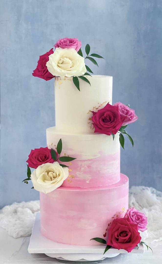 Three-tier white-to-pink ombré wedding cake with roses, Hyderabad