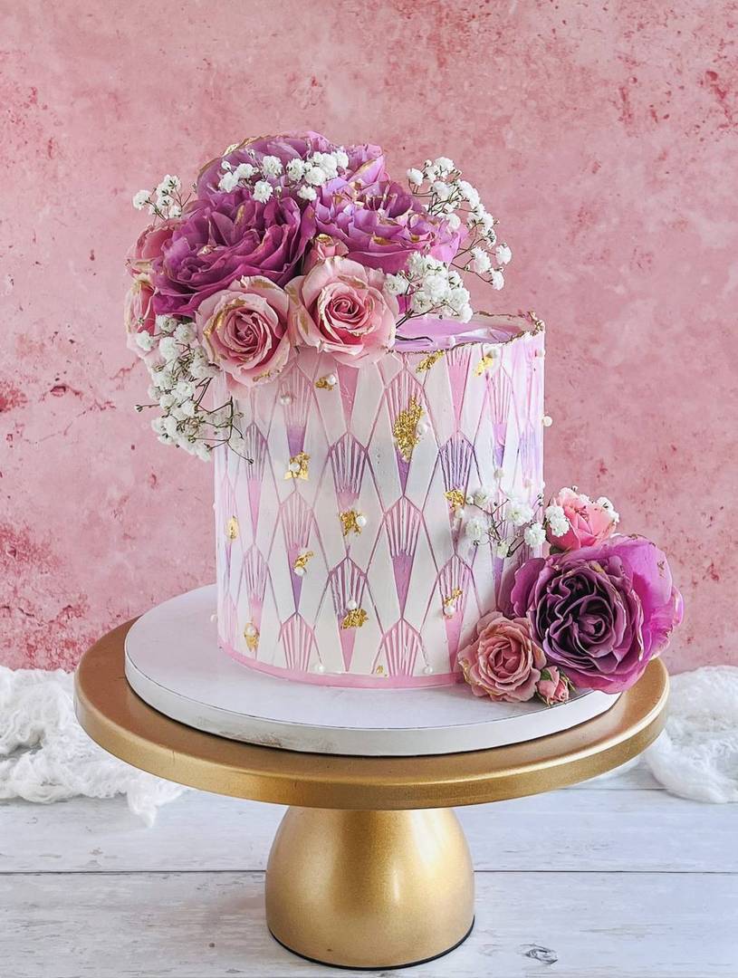 Pink and purple stained-glass cake with peonies and gold leaf
