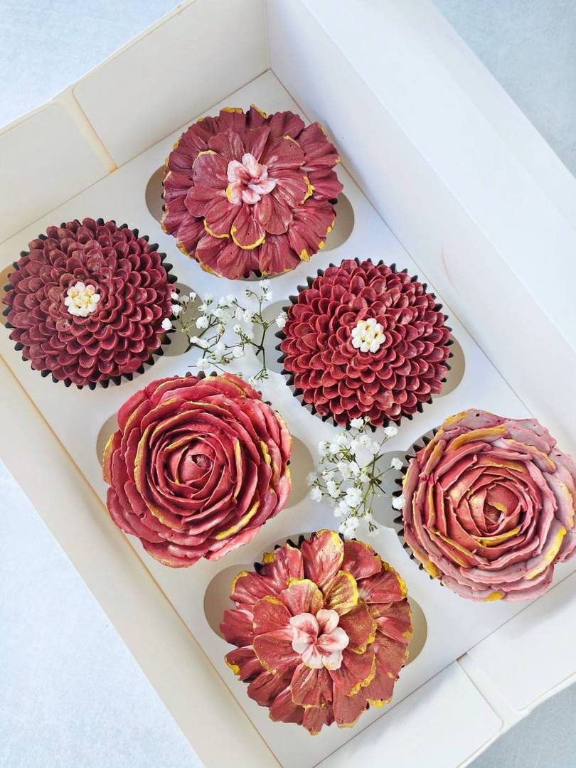 Claret rose and dahlia buttercream cupcakes with gold accents