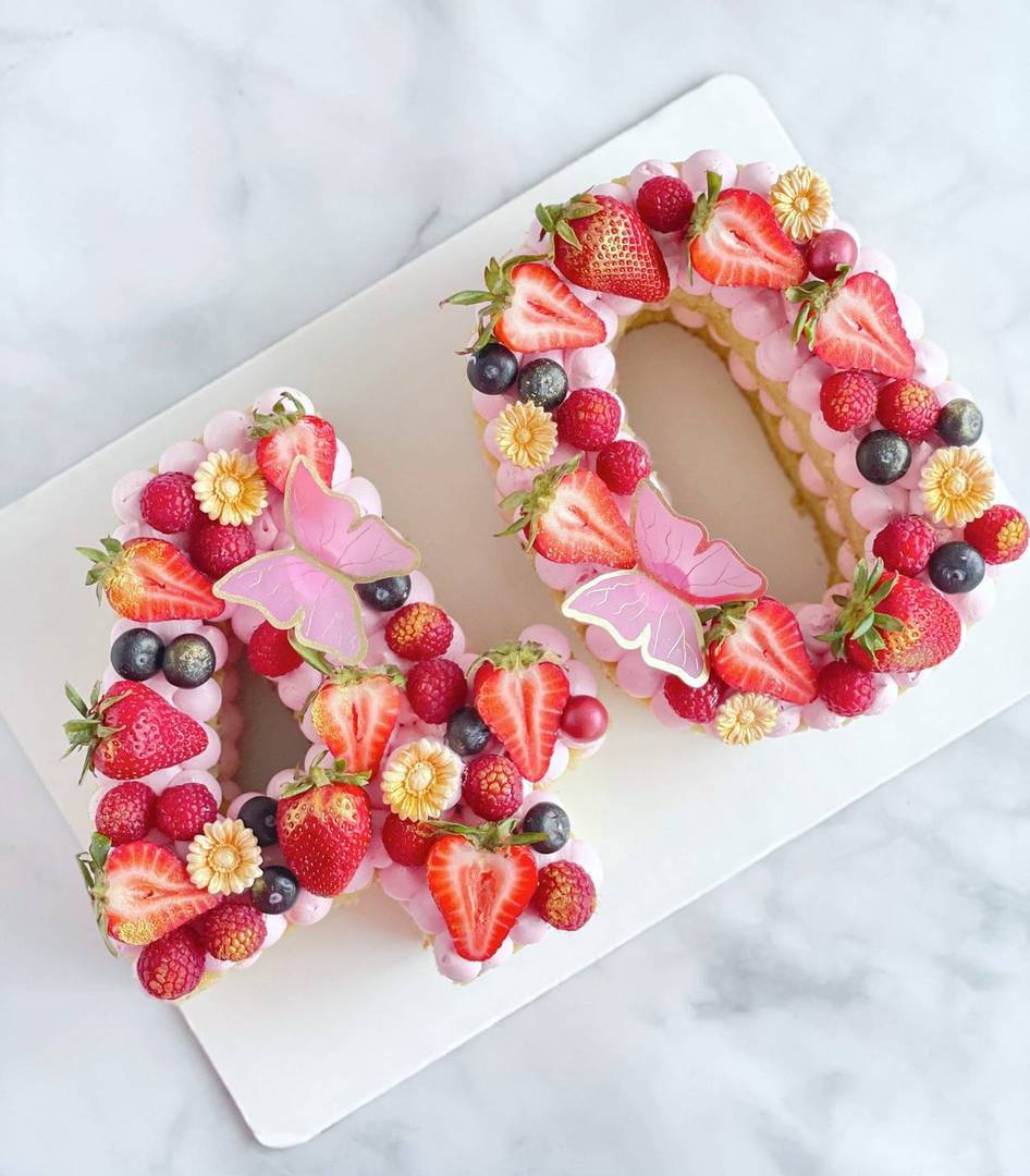 Number 40 cream cake with berries, gold flowers and butterflies